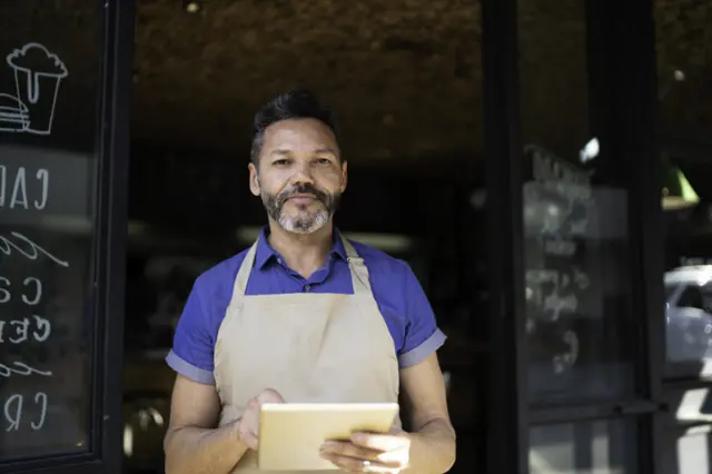 Doorman with clipboard at restaurant