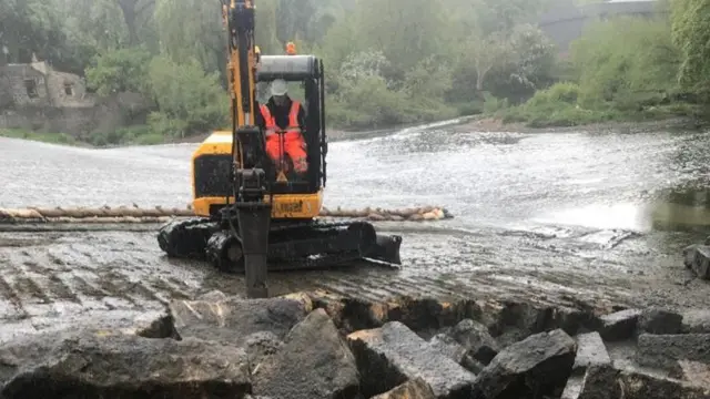 Workers on a fish pass