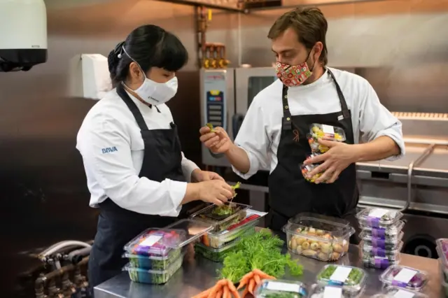 Cooks work in the kitchen of the restaurant El Celler de Can Roca in Girona on 23 June 2020, on the day the restaurant reopens after a national lockdown