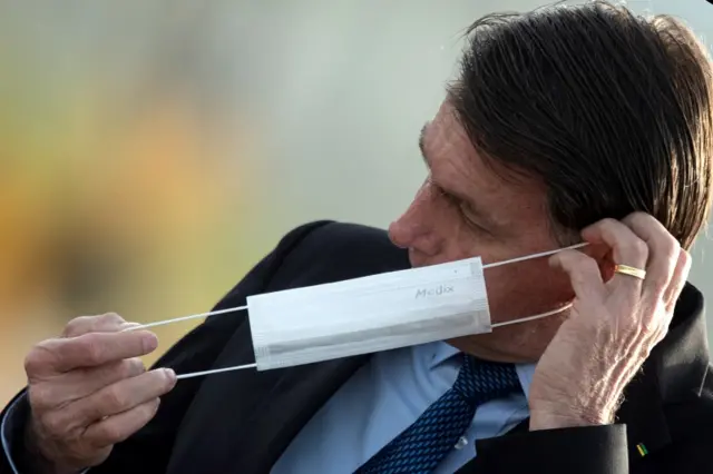 he President of Brazil Jair Bolsonaro participates in the raising of the national flag, in the Palacio do Alvorada, in Brasilia, Brazil, 09 June 2020.