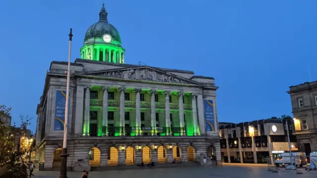 Nottingham council house lit up green