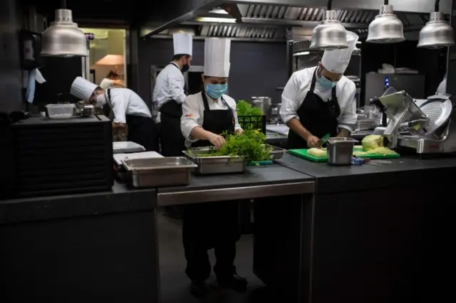 Cooks work in the kitchen of the restaurant El Celler de Can Roca in Girona on 23 June 2020, on the day the restaurant reopens after a national lockdown