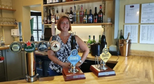 Woman behind bar