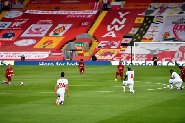 Liverpool and Crystal Palace players take a knee at Anfield