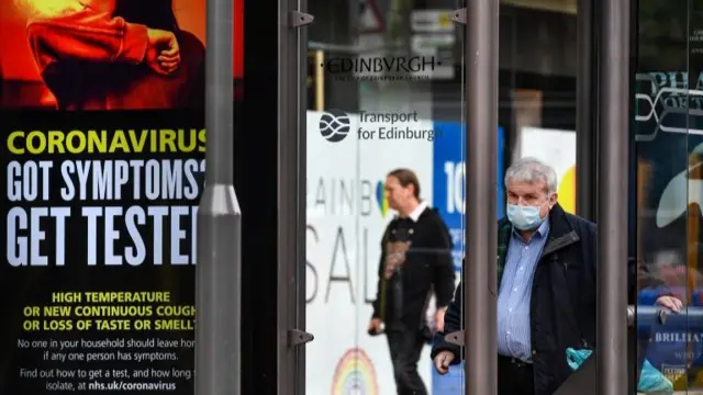 People wear face mask on Princes Street in Edinburgh