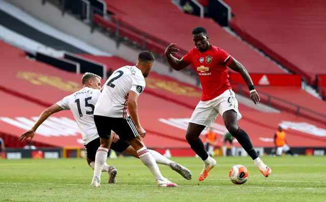 Manchester United's Paul Pogba up against Sheffield United's Phil Jagielka (left) and George Baldock