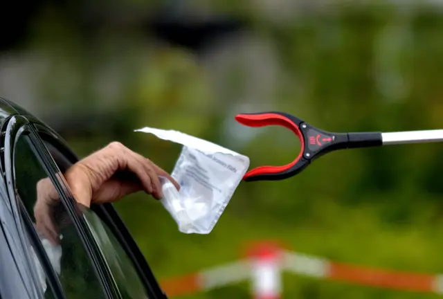 Test being passed to staff via a grabber