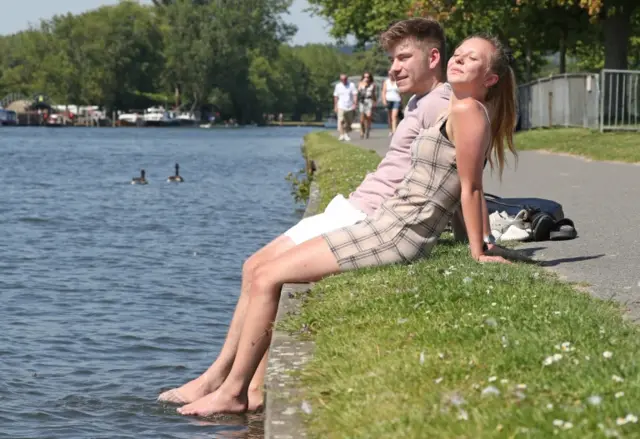 A man and a woman enjoying the sunshine