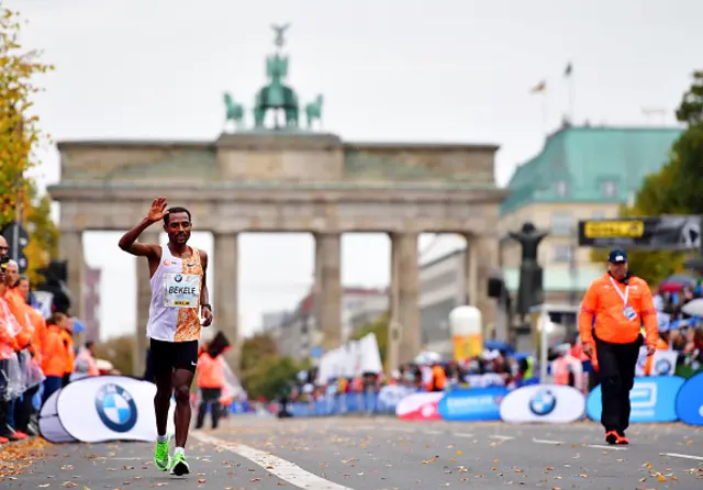 Kenenisa Bekele of Ethiopia acknowledges the crowd as he goes on to win the 46th Berlin Marathon 2019