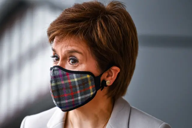 Nicola Sturgeon wears a face mask as she visits a shopping centre in Edinburgh on Friday