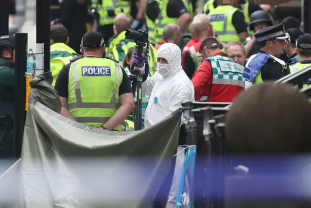 Police officer in forensic suit