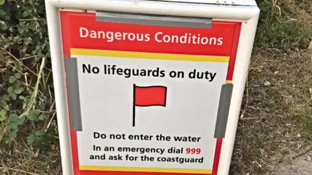 No lifeguards sign at Porthcurno beach