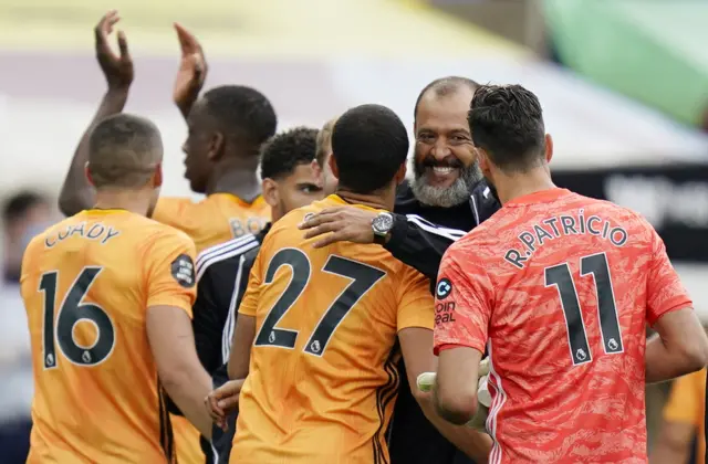 Nuno Espírito Santo celebrates with his Wolves players at full time