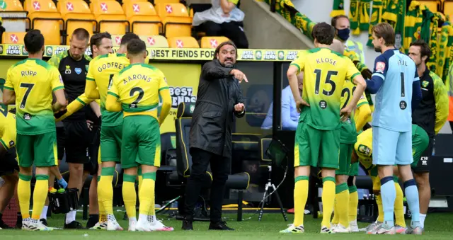 Norwich City manager Daniel Farke speaks to his players