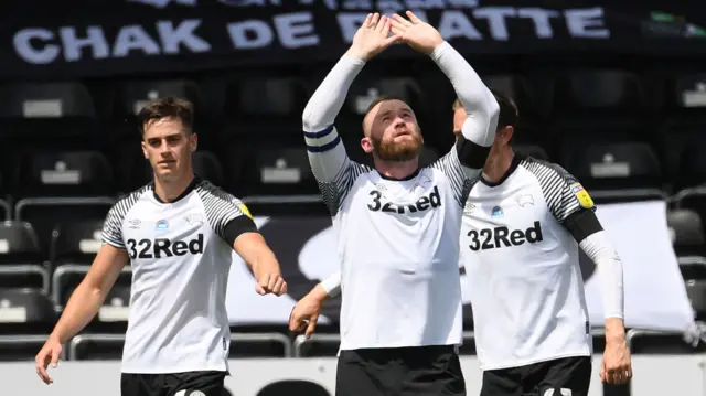 Wayne Rooney celebrates his first-half penalty against Reading