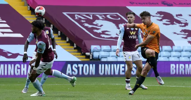 Tyrone Mings blocks Leander Dendoncker's shot