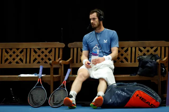 Andy Murray speaks into a headset