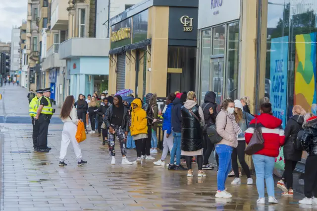 Shoppers queue on Edinburgh's Princes Street