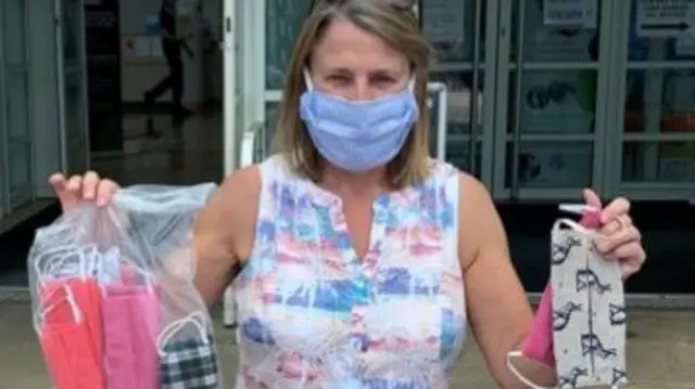 Staff member with donated masks