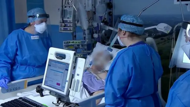 Doctors with patient