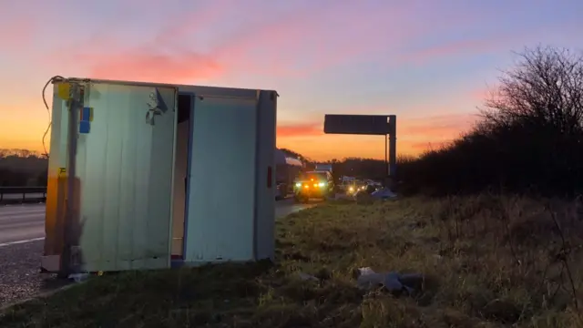 Box van fallen on aside of A1 (M)