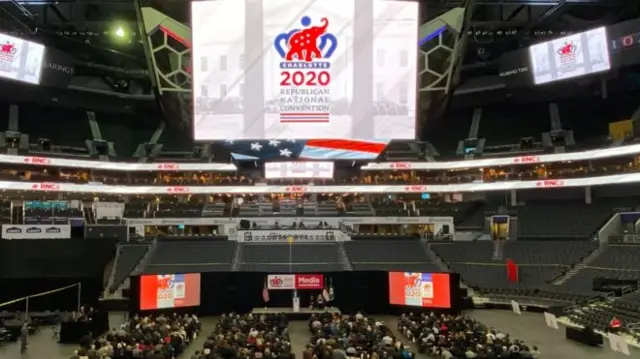 A stadium with signs for the convention