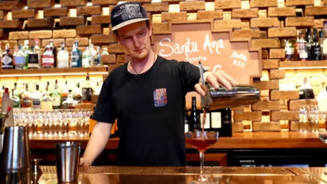 Barkeeper pouring a drink