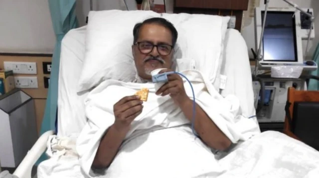 Nitaidas Mukherjee in a hospital bed