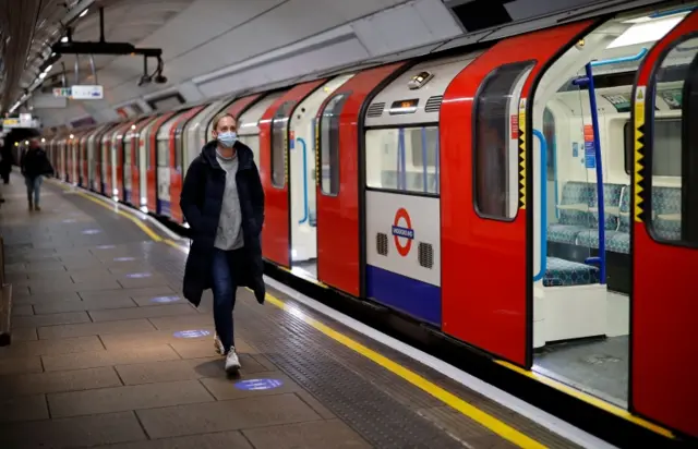 Passenger with mask on Tube