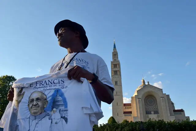 Wilbert Drew, 62, a lifelong Washingtonian sells Pope Francis t-shirts outside the Bascilica of the Shrine of the Immaculate Conception September 13, 2015 in Washington, DC