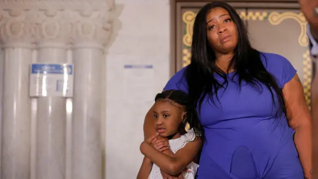 George Floyd"s 6-year-old daughter, Gianna, is embraced by her mother, Roxie Washington, before speaking about her father, following his death in Minneapolis police custody, at the Minneapolis City Hall, in Minneapolis