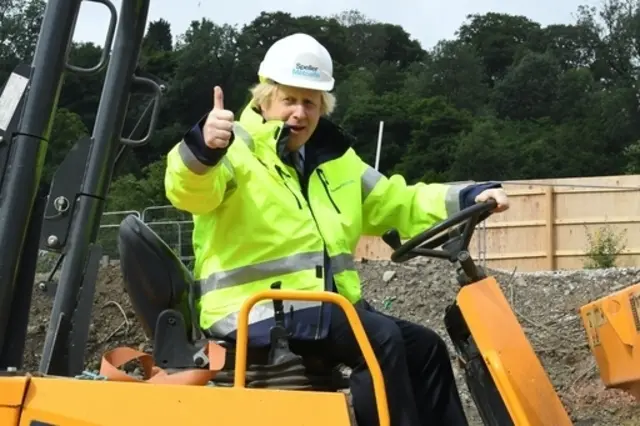 Boris Johnson sits in a digger at he Dudley Institute of Technology this morning