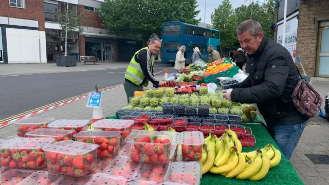 Scott Frake on the fruit and vegetable stall