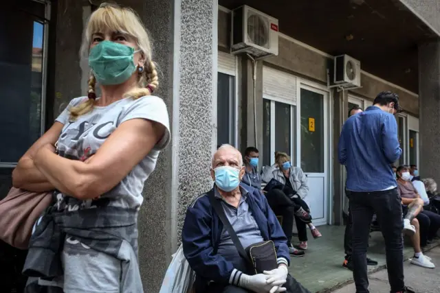 Serbs queuing outside a clinic in Belgrade, 24 Jun 20