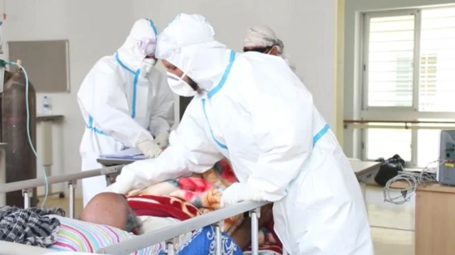 Doctors treat a patient in an Afghan hospital