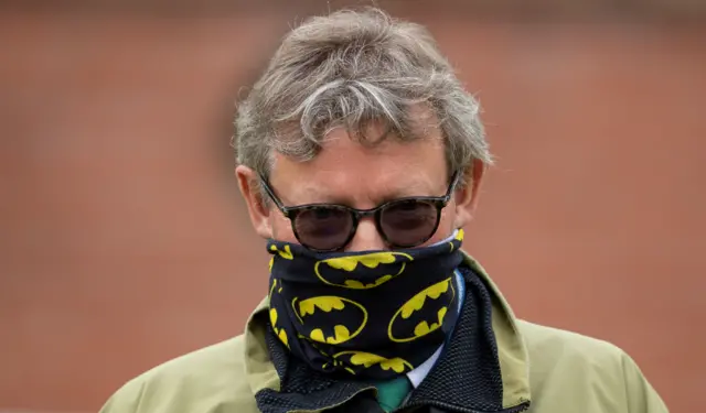 Trainer Mark Johnston wearing a face covering at the horse racing