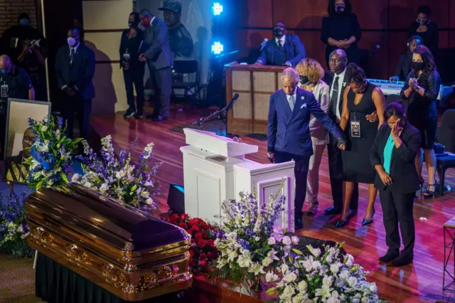 Rev Sharpton (centre) and members of Floyd's family during the memorial