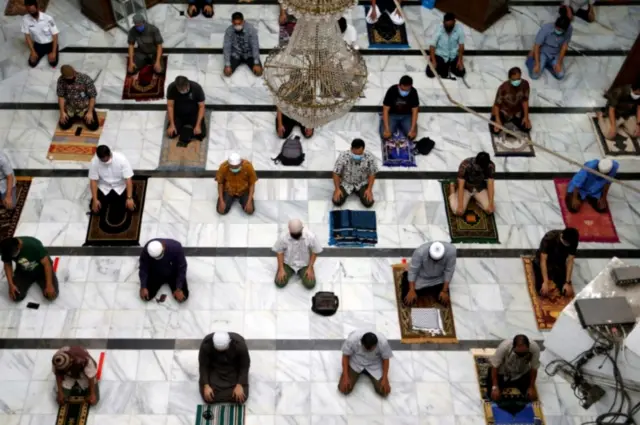 Indonesia Muslims take part in Friday prayers at a mosque