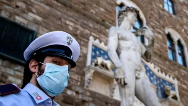 Italian policeman wearing mask