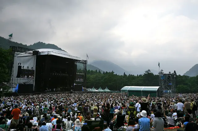 People enjoy a concert during the Fuji Rock Festival at Naeba Ski Resort on July 26, 2008