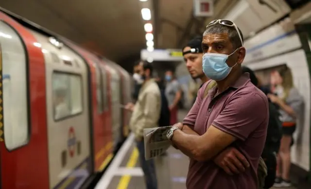 Man wearing mask at Tube station