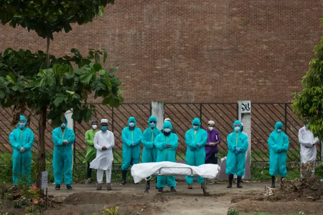 Members of Al-Markazul Islami Bangladesh performs funeral prayers at Rayer Bazar Graveyard, Bangladesh on June 4, 2020. he person died with Covid-19 symptoms.