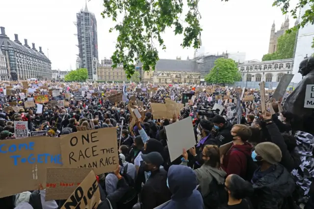 People take part in a Black Lives Matter protest rally in Parliament Square
