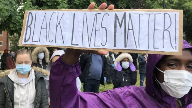 Protester with Black Lives Matter placard