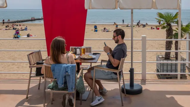 Tourists at a bar at the Capannina Beach in Jesolo