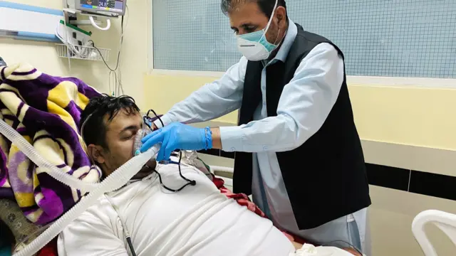 A patient infected with Covid-19 receives medical care at a hospital in Kabul, Afghanistan, 1 June 2020