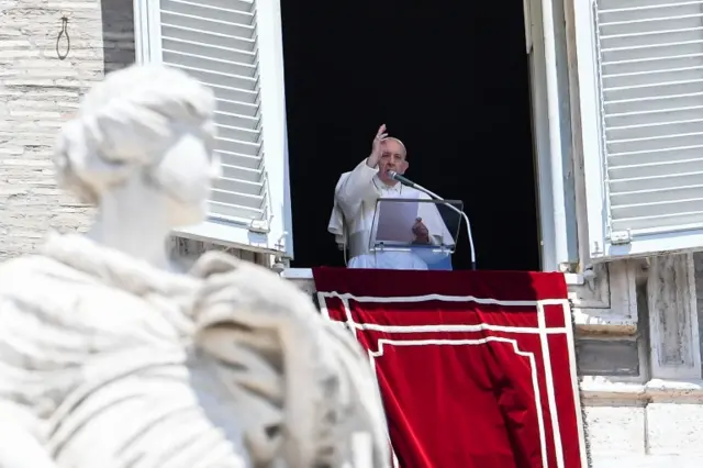 Pope Francis blesses the crowd from the window of the apostolic palace overlooking St Peter's Square on 7 June 2020 in the Vatican