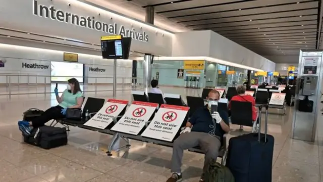 People at an airport in the UK