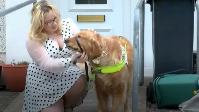 Angharad Paget Jones with her guide dog Tudor