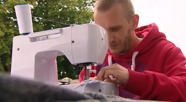 Mickey Sykes and his sewing machine